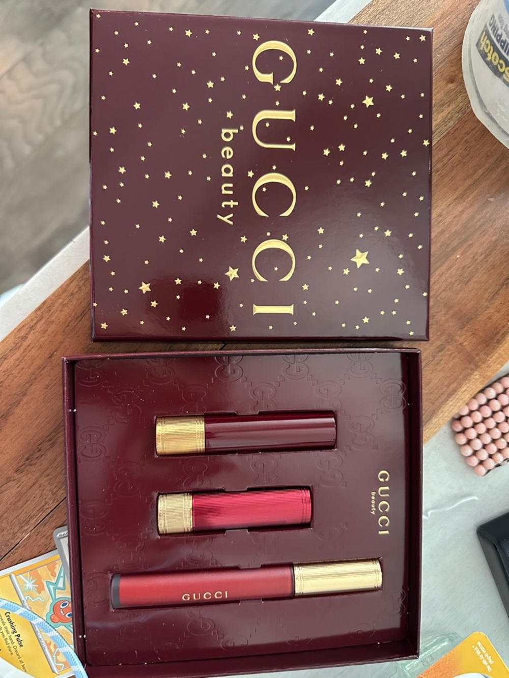 Gucci Beauty Lip Trio in Burgundy and Gold Packaging